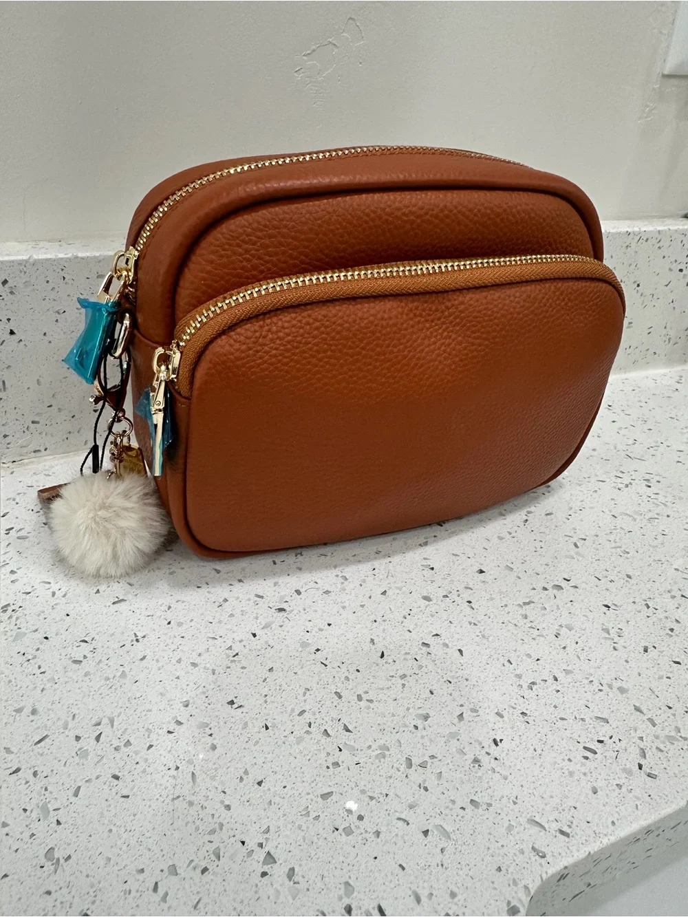 Women's Tan Double-Zip Crossbody Bag with Pom Charm